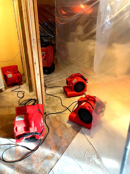 Ungerman drying equipment running in a water-damaged home during a documented loss