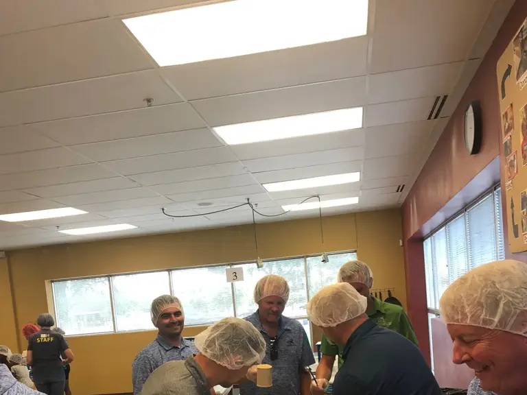 The Ungerman crew working together at a Feed My Starving Children packing session