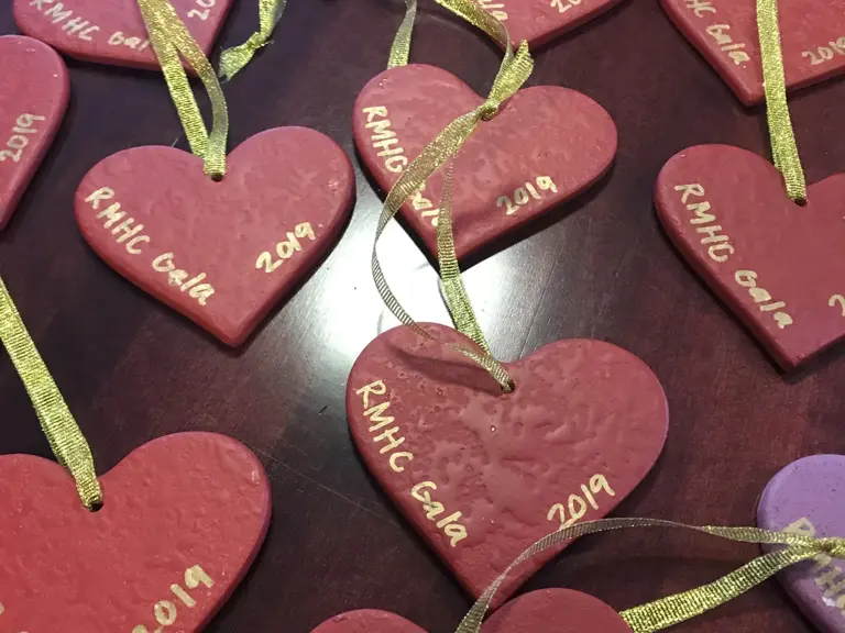 Hand-painted heart ornaments made for the Ronald McDonald House Charities gala