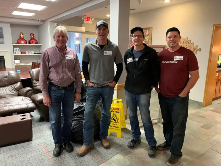 Ungerman team members gathered in the common area at Ronald McDonald House