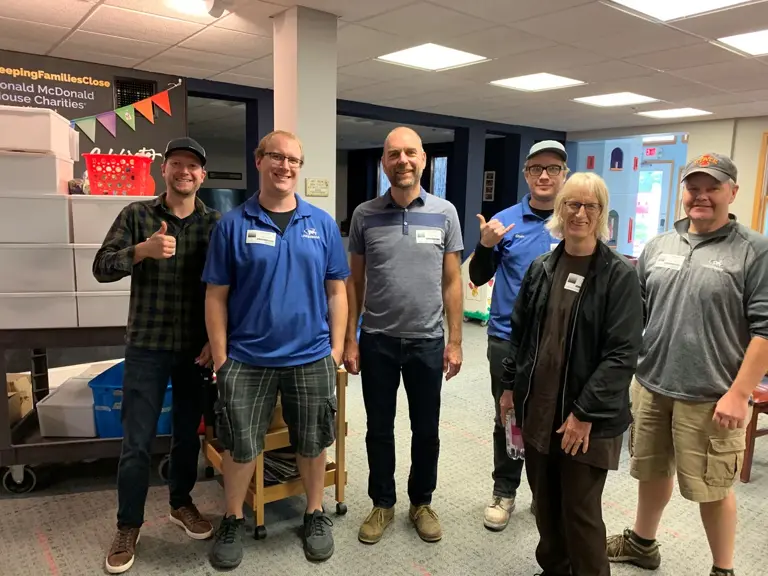 Ungerman volunteers wearing visitor badges at Ronald McDonald House