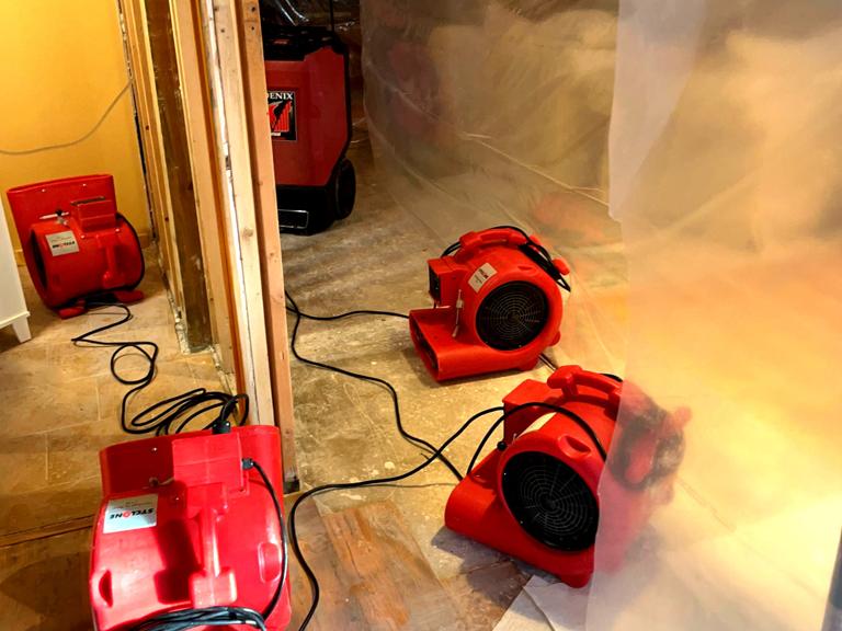 Ungerman drying equipment running in a water-damaged home during a documented loss