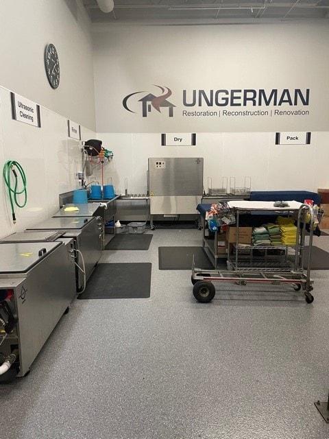 Ungerman's in-house contents cleanroom with ultrasonic cleaning, wash, dry, and pack stations for restoring personal property after a fire