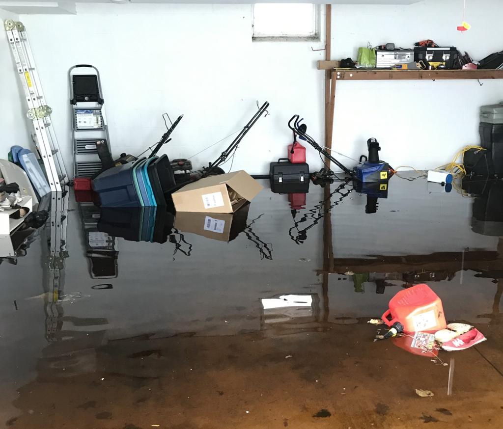 Picture of a flooded garage after snow melted in the spring.