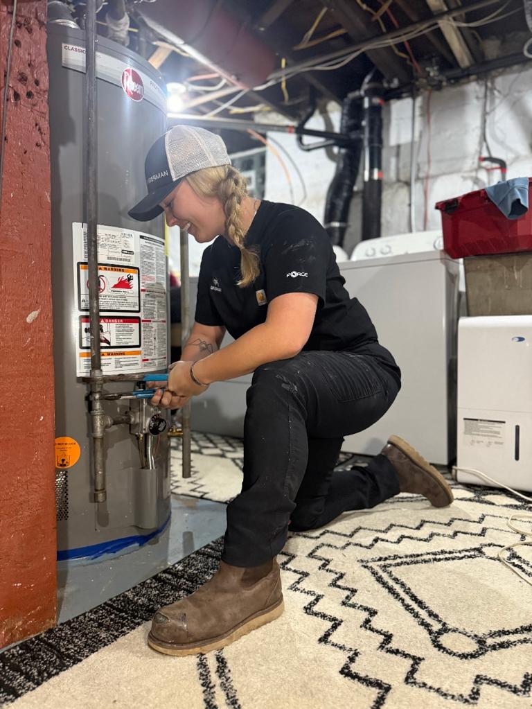 Ungerman technician servicing a residential water heater
