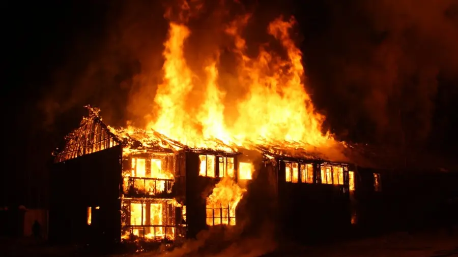 Picture of a residential house on fire.