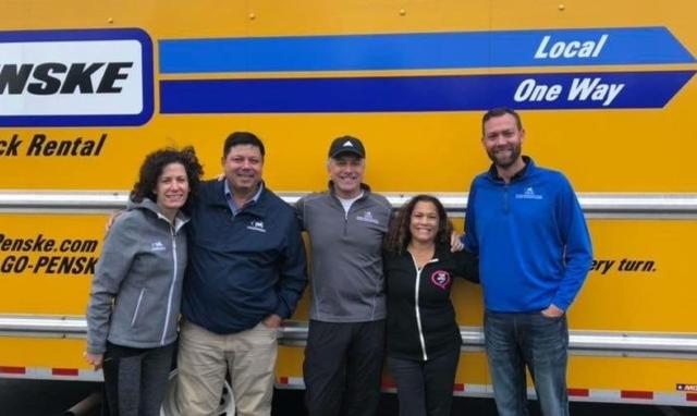 Ungerman team members standing together in front of a company truck.